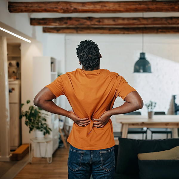 Woman holding her back 